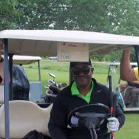 3 men waiting for event in golf cart